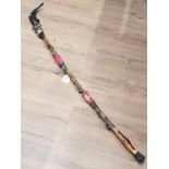 WOODEN WALKING CANE IN A VOODOO DESIGN WITH SHEEP HORN HANDLE