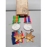 SMALL BOX CONTAINING 4 WAR SERVICE MEDALS INCLUDES 1939 45 BATTLE OF BRITAIN STAR THE ITALY STAR