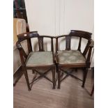 A PAIR OF ANTIQUE CORNER CHAIRS IN MAHOGANY