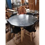 A PAIR OF PAINTED PINE CIRCULAR TOPPED TABLES AND 8 CHAIRS