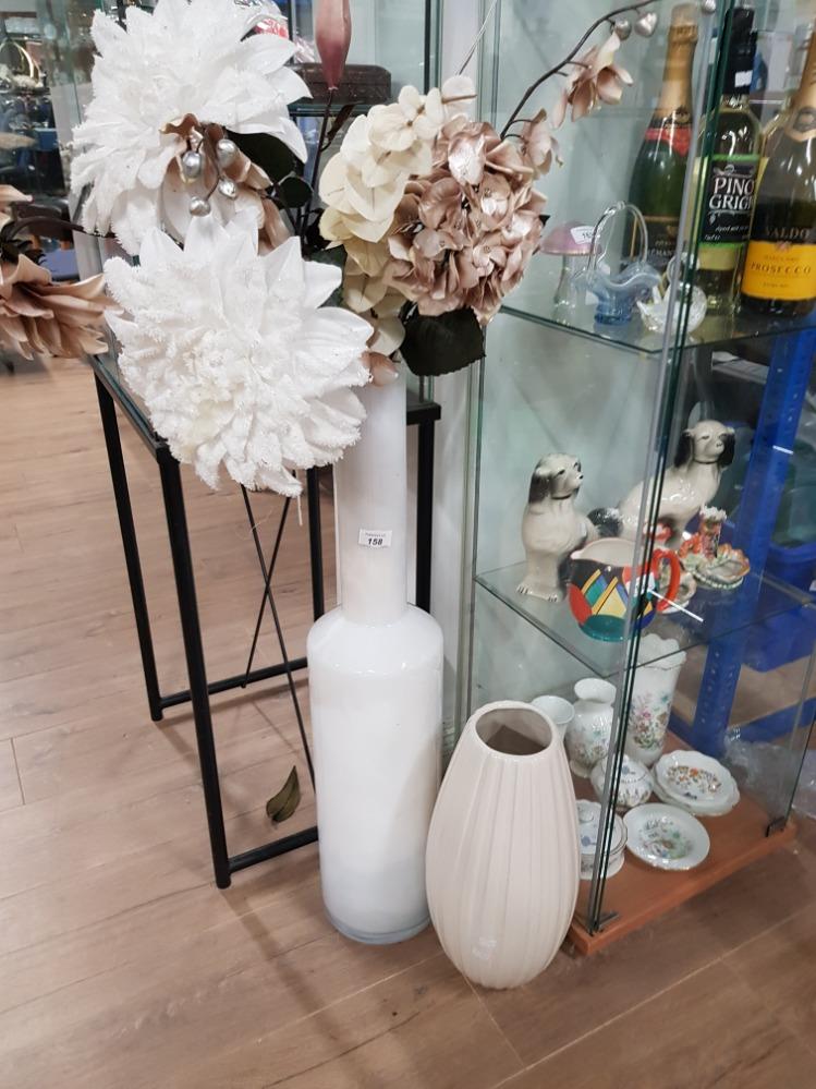 A LARGE GLASS VASE WITH ARTIFICIAL FLOWERS AND ONE OTHER