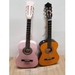 A CHANTRY ACOUSTIC GUITAR TOGETHER WITH A PINK HERALD ACOUSTIC GUITAR