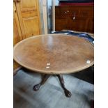 CIRCULAR WALNUT TOPPED COFFEE TABLE ON PEDESTAL BASE WITH CLAW AND BALL FEET