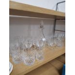 A LARGE AMOUNT OF CRYSTAL CUT GLASS INC DECANTERS AND WHISKEY TUMBLERS ETC