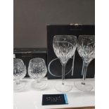 A PAIR OF STUART CRYSTAL BRANDY BALLOONS TOGETHER WITH A PAIR OF STUART CRYSTAL WINE GLASSES BOTH