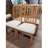 A SET OF 4 RUBBERWOOD DINING CHAIRS