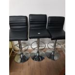3 BLACK LEATHERETTE SEATED AND METAL BASED SWIVEL KITCHEN STOOLS