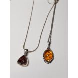 2 SILVER AND AMBER PENDANTS ON CHAINS GROSS WEIGHT 8G