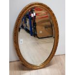 GILT FRAMED OVAL SHAPED MIRROR