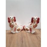 A PAIR OF STAFFORDSHIRE STYLE DOG ORNAMENTS