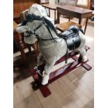 MODERN ROCKING HORSE ON WOODEN BASE