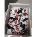 A BOX CONTAINING BRITAINS LEAD FIGURES AND HORSES