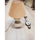 A BAROMETER WITH A TABLE LAMP