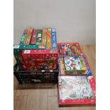 A BOX CONTAINING ASSORTMENT OF JIGSAWS ALL CHRISTMAS THEMED