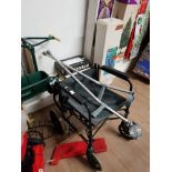 A WHEELCHAIR TOGETHER WITH CRUTCHES