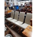 A SET OF 4 MODERN LEATHERETTE DINING CHAIRS