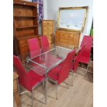 MODERN CHROME BASED TABLE WITH GLASS TOP AND A SET OF 6 RED ANC CHROME CHAIRS