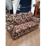 MODERN 3 SEATER SOFA IN PURPLE FLORAL FABRIC ON BRASS CASTERS