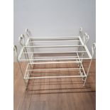 A PAIR OF METAL SHOE RACKS