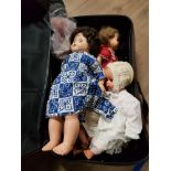 A SUITCASE CONTAING ASSORTED DOLLS