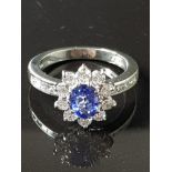 BOODLES SAPPHIRE AND DIAMOND HALO RING SET IN 18CT WHITE GOLD HALO OF BRILLIANT CUT DIAMONDS TOTAL