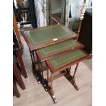 A NEST OF 3 LEATHER INLAID MAHOGANY TABLES