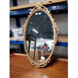 ORNATE GILT FRAMED OVAL MIRROR