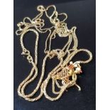 BAG CONTAINING 3 FINE GOLD CHAINS AND GOLFER PENDANT 14.2G
