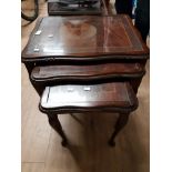 INLAID MAHOGANY NEST OF THREE TABLES WITH GLASS TOPS