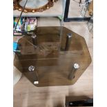 OCTAGONAL SHAPED COFFEE TABLE WITH 4 CHROME EFFECT LEGS AND SMOKED GLASS TOP