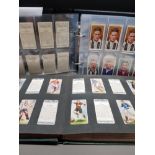 A COLLECTION OF 534 FOOTBALL CIGARETTE CARDS IN TRADITIONAL AND MODERN ALBUMS WITH 56 PLASTIC