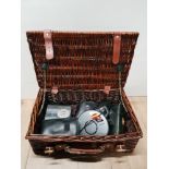 A WICKER BASKET CONTAINING TOSHIBA GRAPHIC EQUALIZER CANON SURE SHOT ETC