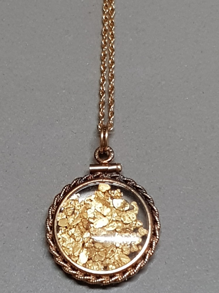 STAMPED 12KT PENDANT ON CHAIN CONTAINING GOLD LEAF 4.5G