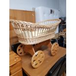 PINE AND WICKER MOSES BASKET ON WHEELS
