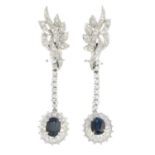 A pair of sapphire and diamond earrings.