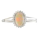 An opal and diamond hinged bangle.