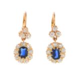 A pair of sapphire and diamond earrings.