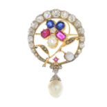 A diamond and gem-set brooch.