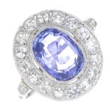 A sapphire and diamond cluster ring.