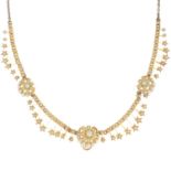 An early 20th century gold split and seed pearl necklace.