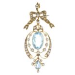 An early 20th century 15ct gold aquamarine and split pearl pendant.