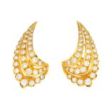 A pair of diamond earrings.