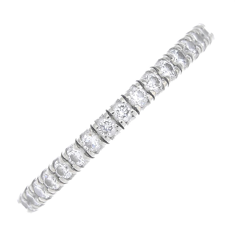 CARTIER - an 18ct gold diamond 'Étincelle' full eternity ring.