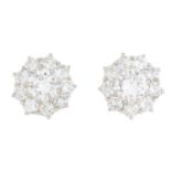 A pair of diamond floral cluster earrings.