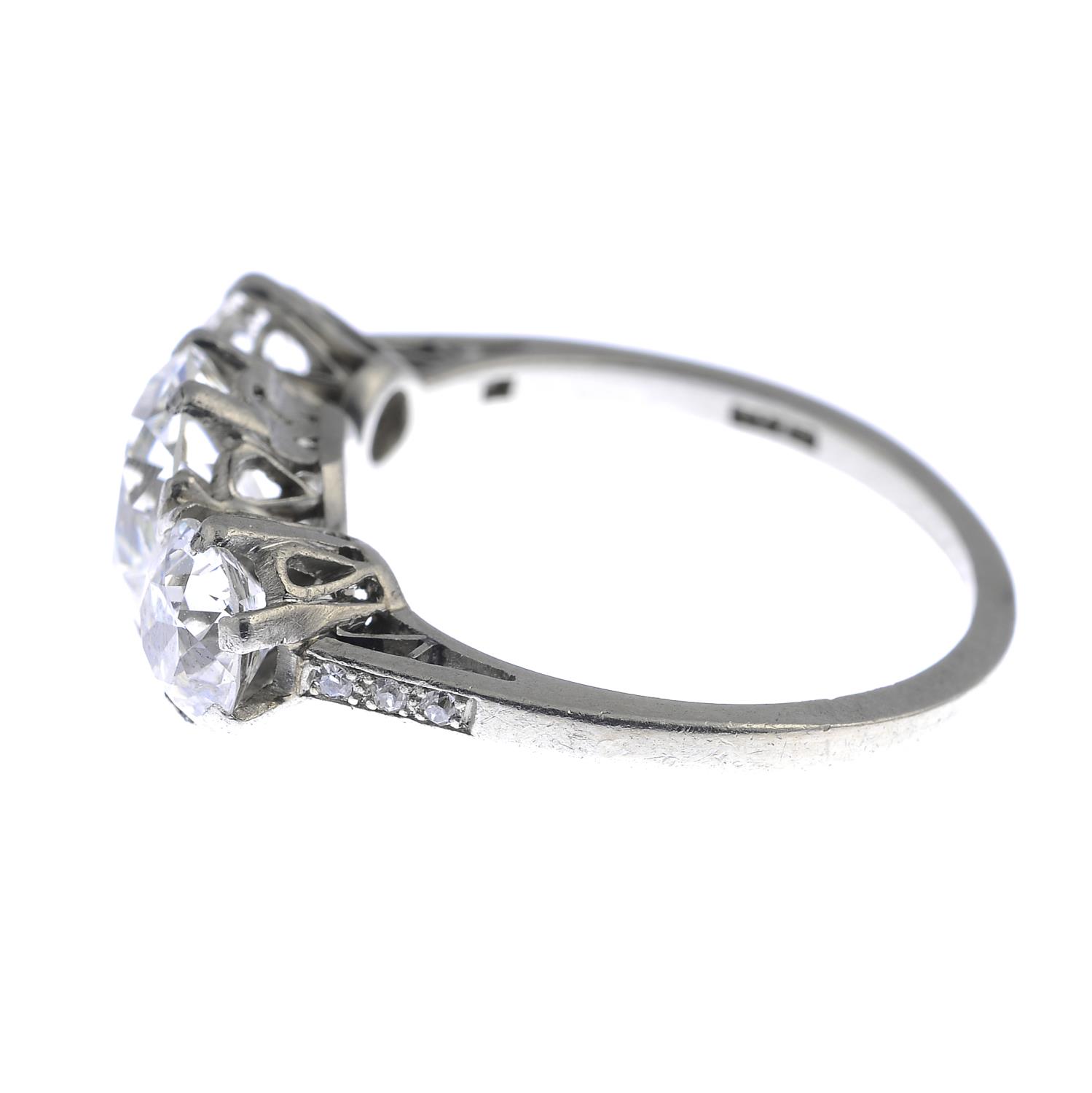 A mid 20th century platinum diamond three-stone ring. - Image 2 of 3