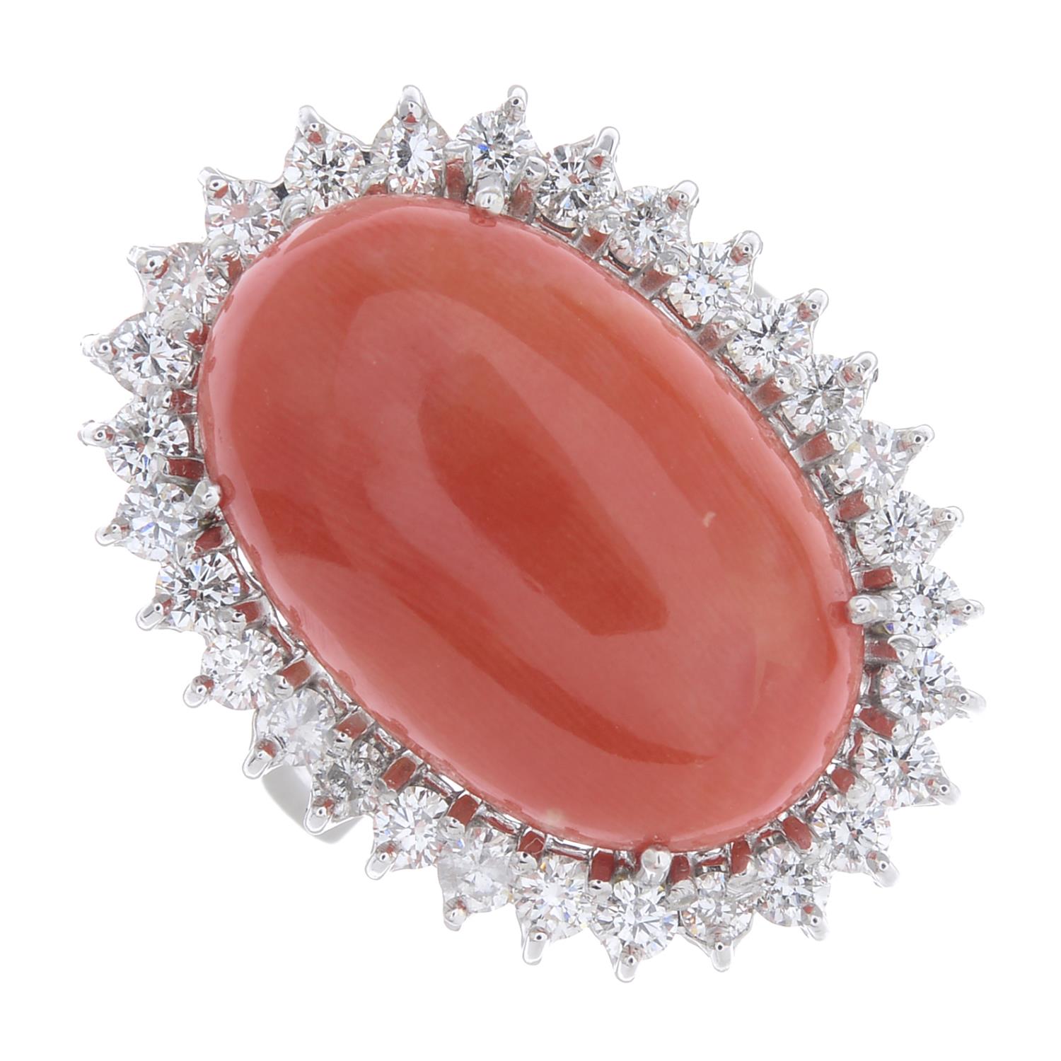 A coral and diamond cluster ring.