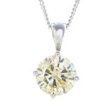 An 18ct gold diamond single-stone pendant.