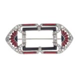 An Art Deco platinum and gold, onyx, enamel and diamond brooch.
