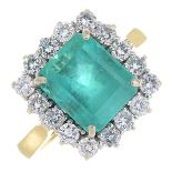 An 18ct gold Colombian emerald and diamond cluster ring.