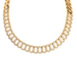 CARTIER - an 18ct gold diamond 'C Heart of Cartier' necklace.